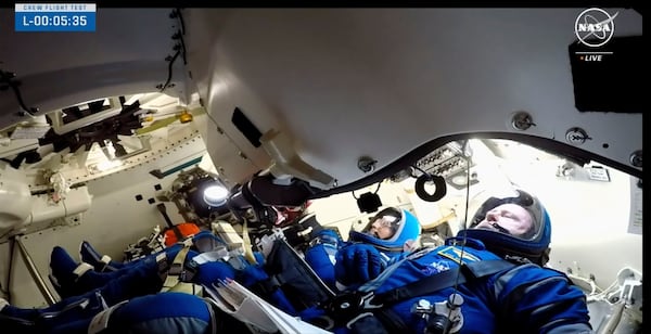 FILE - In this image from video provided by NASA, astronauts Butch Wilmore, right and Suni Williams wait for liftoff inside a Boeing Starliner capsule at Space Launch Complex 41 in Cape Canaveral, Fla., on Wednesday, June 5, 2024, for a trip to the International Space Station. (NASA via AP, File)