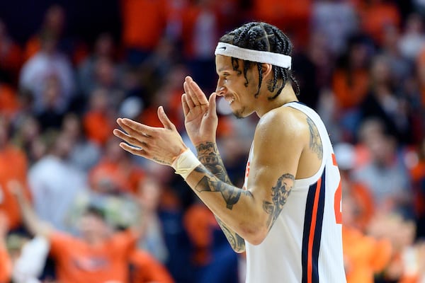 Illinois' Tre White celebrates during an NCAA college basketball game against Purdue, Friday, March 7, 2025, in Champaign, Ill. (AP Photo/Craig Pessman)