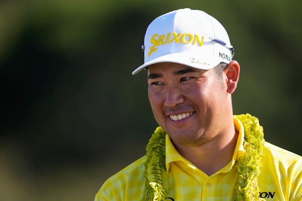 Hideki Matsuyama, of Japan, reacts after winning The Sentry golf event, Sunday, Jan. 5, 2025, at Kapalua Plantation Course in Kapalua, Hawaii. (AP Photo/Matt York)