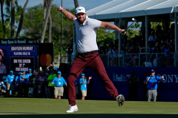 FILE - Grayson Murray celebrates winning the Sony Open golf event, Sunday, Jan. 14, 2024, at Waialae Country Club in Honolulu. (AP Photo/Matt York, File)