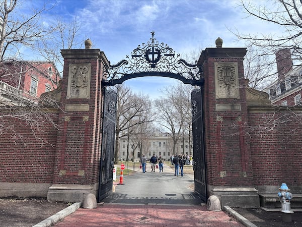 People walk through the campus of Harvard University in Cambridge, Mass., Tuesday, March 18, 2025, which announced plans to make tuition free for students of families making up to $200,00. (AP Photos/Michael Casey)