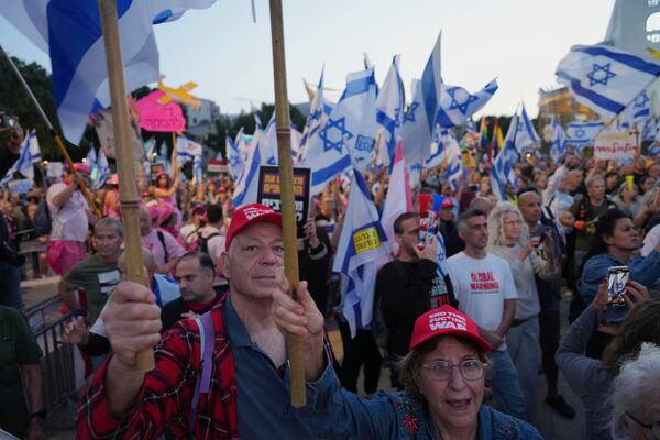People take part in a protest demanding the end of the war and immediate release of hostages held by Hamas in the Gaza Strip, and against Prime Minister Benjamin Netanyahu's government in Tel Aviv, Israel, Saturday, May 3, 2025.(AP Photo/Ariel Schalit)