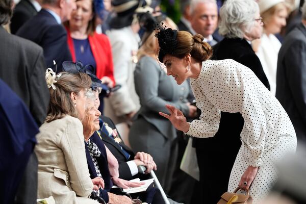 Kate, Princess of Wales, speaks to a veteran during a Service of Thanksgiving at Westminster Abbey on V-E Day in London, Thursday, May 8, 2025. (Jordan Pettitt/Pool Photo via AP)