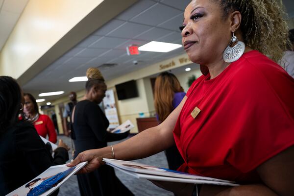 Programs are passed out before the memorial of singer and actress Angie Stone, Friday, March 14, 2025, in Austell. Ga. (AP Photo/Olivia Bowdoin)