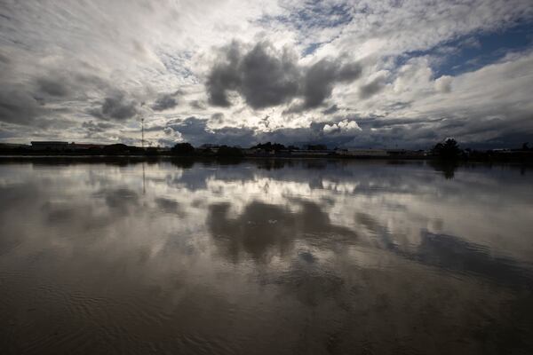 FILE - Clouds are reflected in the Whanganui River at the town of Whanganui, New Zealand, on June 17, 2022. (AP Photo/Brett Phibbs, File)