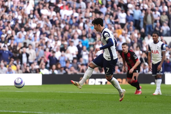 Tottenham Hotspur's Son Heung-Min scores during the English Premier League soccer match between Tottenham Hotspur and Bournemouth, at the Tottenham Hotspur Stadium, in London, Sunday March 9, 2025. (Bradley Collyer/PA via AP)