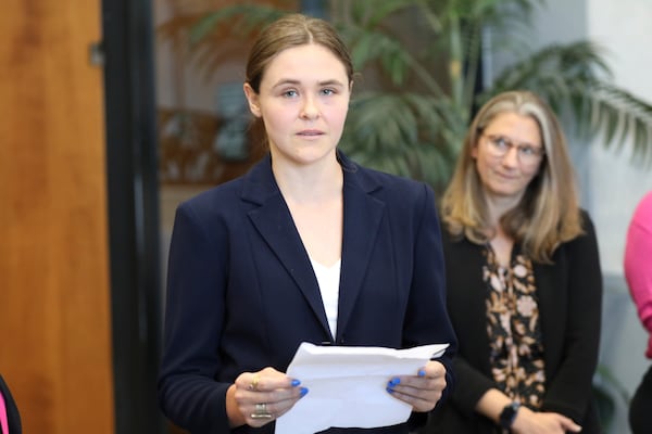 FILE - Taylor Shelton, who sued South Carolina over the definition of "heartbeat" under the state's 2023 abortion law, reads a statement after her case was argued in court on Thursday, May 2, 2024, in Columbia, S.C. (AP Photo/Jeffrey Collins, File)