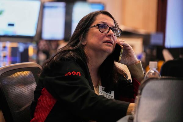 Trader Phyllis Arena Woods works on the floor of the New York Stock Exchange, Tuesday, May 6, 2025. (AP Photo/Richard Drew)