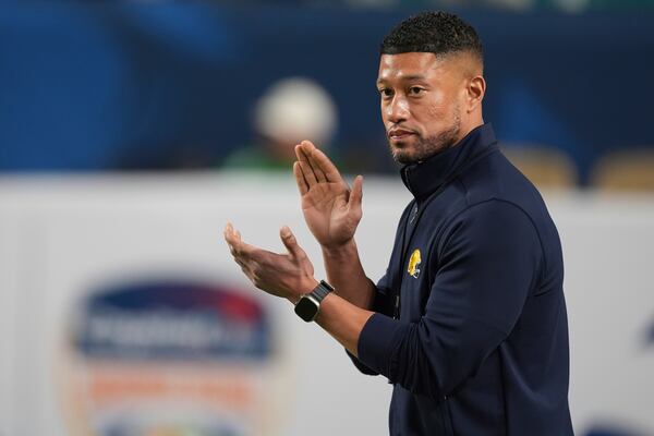 Notre Dame head coach Marcus Freeman claps before the Orange Bowl NCAA College Football Playoff semifinal game against Penn State, Thursday, Jan. 9, 2025, in Miami Gardens, Fla. (AP Photo/Rebecca Blackwell)