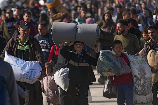 Displaced Palestinians return to their homes in the northern Gaza Strip, following Israel's decision to allow thousands of them to go back for the first time since the early weeks of the 15-month war with Hamas, Monday, Jan. 27, 2025. (AP Photo/Abdel Kareem Hana)