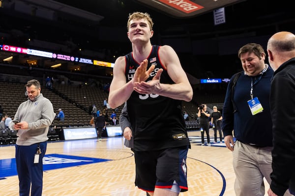 UConn forward Liam McNeeley (30) exits the court after an NCAA college basketball game against Creighton, Tuesday, Feb. 11, 2025, in Omaha, Neb. (AP Photo/Bonnie Ryan)