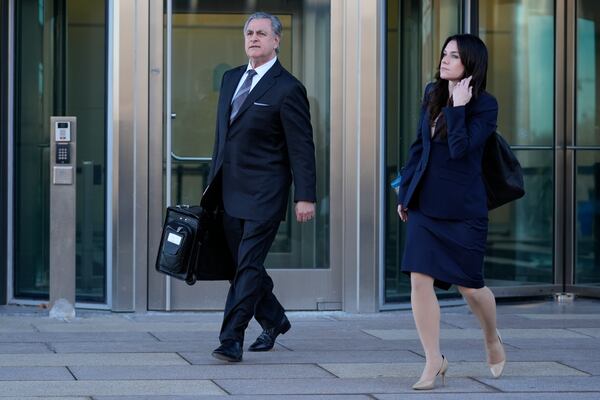 Public defenders George Leondard, left, and Kylie Blatti, leave the Will County Courhouse after the first day of the trial of Joseph Czuba, 73, who is charged with the fatal stabbing of six-year-old Palestinian boy Wadee Alfayoumiand and the wounding of his mother Hanan Shaheen, Tuesday, Feb. 25, 2025, in Joliet, Ill. (AP Photo/Erin Hooley)