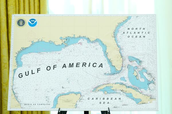 A map with Gulf of America written on it is pictured during a swearing in ceremony for Dr. Mehmet Oz to be Administrator of the Centers for Medicare and Medicaid Services, in the Oval Office of the White House, Friday, April 18, 2025, in Washington. (AP Photo/Alex Brandon)