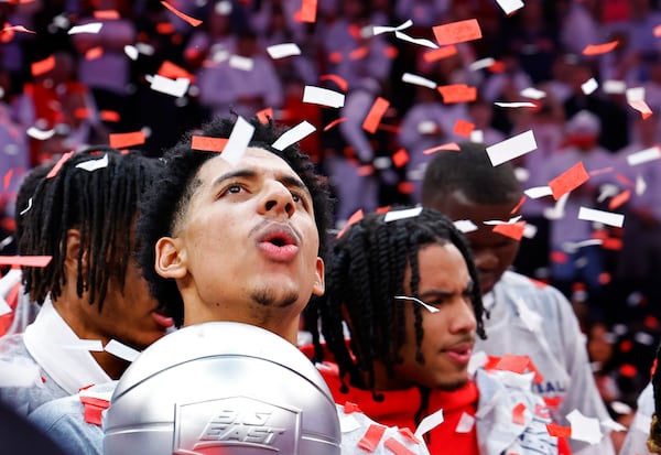 St. John's guard RJ Luis Jr. celebrates with teammates after winning the Big East regular season conference title NCAA college basketball game against Seton Hall, Saturday, March 1, 2025, in New York. (AP Photo/Noah K. Murray)