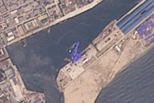 This satellite image from Planet Labs PBC shows a blue tarp covering a North Korean destroyer after it suffered a failed launch while it was being put to sea in Chongjin, North Korea, Thursday, May 22, 2025. (Planet Labs PBC via AP)