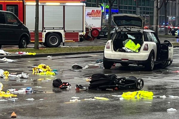 Emergency services attend the scene of an accident after a driver hit a group of people in Munich, Germany, Thursday Feb. 13, 2025. (Christoph Trost/dpa via AP)