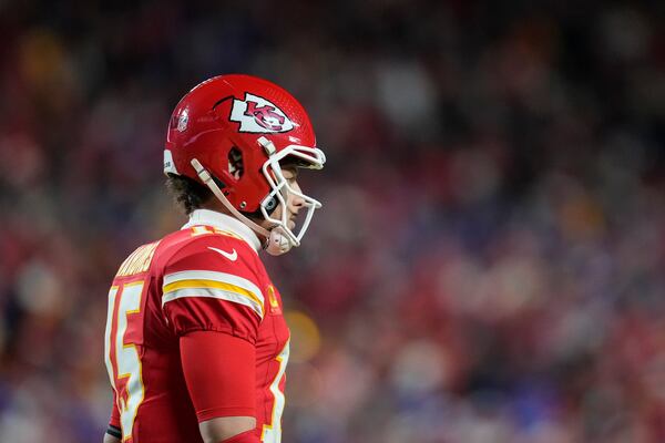 Kansas City Chiefs quarterback Patrick Mahomes (15) celebrates his touchdown against the Buffalo Bills during the first half of the AFC Championship NFL football game, Sunday, Jan. 26, 2025, in Kansas City, Mo. (AP Photo/Ashley Landis)