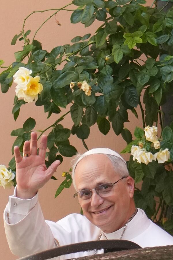 Pope Leo XIV leaves the Augustinian General House after a visit in Rome, Tuesday, May. 13, 2025. (AP Photo/Domenico Stinellis)