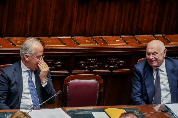 Italian Interior Minister Matteo Piantedosi, left, and Justice Minister Carlo Nordio, right, attend a debate in the Italian lower Chamber in Rome, Wednesday, Feb. 5, 2025, over the controversial repatriation, last week, of a Libyan warlord, Ossama Anjiem, also known as Ossama al-Masri, wanted by the International Criminal Court in the Hague, and who had been arrested in Turin, northern Italy. (AP Photo/Gregorio Borgia)