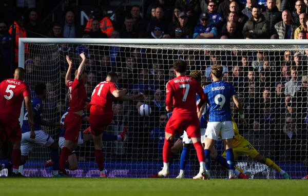 Nottingham Forest's Nikola Milenkovic scores their side's first goal of the game during the English Premier League soccer match between Ipswich Town and Nottingham Forest at Portman Road, Ipswich, England, Saturday March 15, 2025. (John Walton/PA via AP)