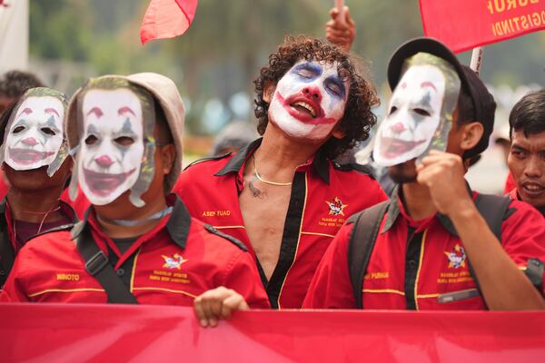 A laborer with their face painted as the Joker chants slogans during a May Day rally in Jakarta, Indonesia, Thursday, May 1, 2025. (AP Photo/Tatan Syuflana)