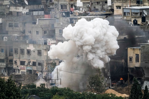 Israeli soldiers detonate an explosive device during a military raid in the West Bank refugee camp of Nur Shams, Tulkarem, Sunday, Feb. 9, 2025. (AP Photo/Majdi Mohammed)