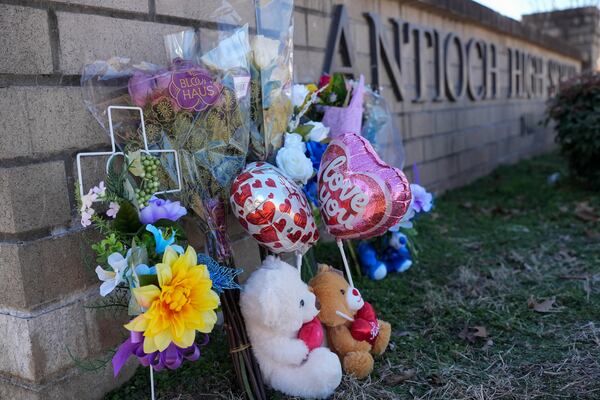 Flowers and stuffed animals are seen at a memorial for victims of a shooting at Antioch High School, Thursday, Jan. 23, 2025, in Nashville, Tenn. (AP Photo/George Walker IV)