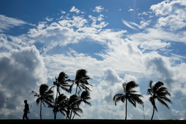 Eric Cole walks away from the 17th green during the first round of the Sony Open golf event, Thursday, Jan. 9, 2025, at Waialae Country Club in Honolulu. (AP Photo/Matt York)