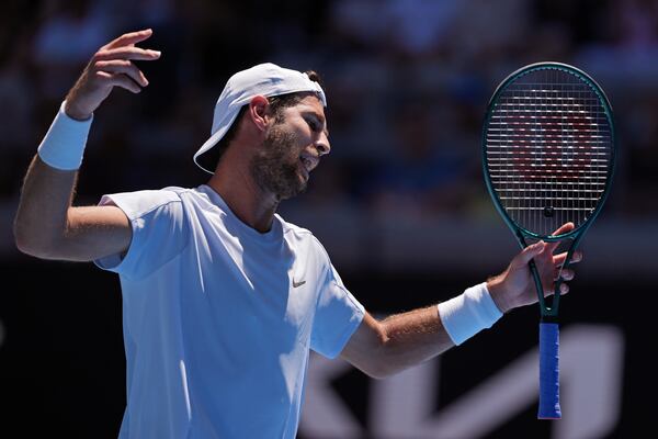 Karen Khachanov of Russia reacts during his third round match against Alex Michelsen of the U.S. at the Australian Open tennis championship in Melbourne, Australia, Saturday, Jan. 18, 2025. (AP Photo/Ng Han Guan)