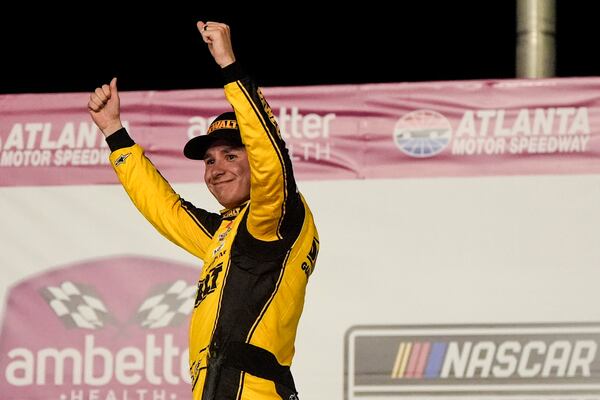 Christopher Bell celebrates victory after a NASCAR Cup Series auto race, Sunday, Feb. 23, 2025, in Hampton, Ga. (AP Photo/Mike Stewart)