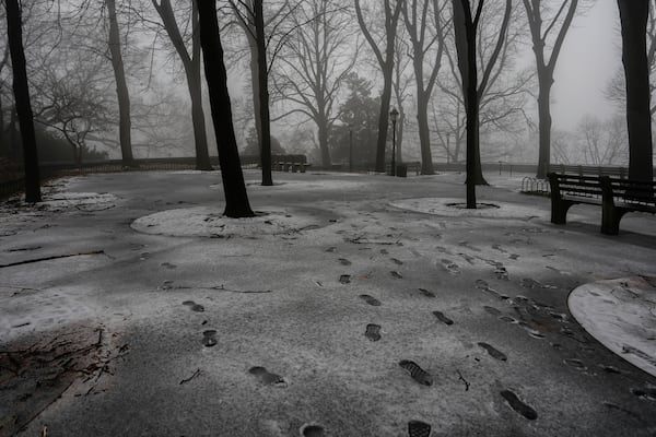 Footprints are seen in snow in Fort Tryon Park, Thursday, Feb. 6, 2025, in New York. (AP Photo/Julia Demaree Nikhinson)