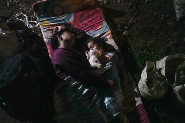 Venezuelan migrant Gabriela Villanueva camps out with her daughter in Puerto Carti, on Panama's Caribbean coast, Saturday, Feb. 22, 2025, where they plan to board boats to Colombia after turning back from southern Mexico where they gave up hopes of reaching the U.S. amid President Trump's crackdown on migration. (AP Photo/Matias Delacroix)