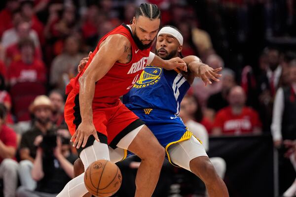 Houston Rockets forward Dillon Brooks (9) backs down Golden State Warriors guard Moses Moody (4) during the second half of Game 5 of an NBA basketball first-round playoff series, Wednesday, April 30, 2025, in Houston. (AP Photo/David J. Phillip)