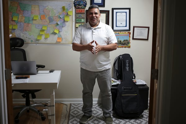 José Palma, a 48 year-old Salvadoran who has lived in the U.S. since 1998, stands in his home in Texas on Wednesday, Jan. 8, 2025. (AP Photo/Lekan Oyekanmi)