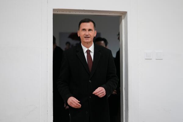 Dragan Primorac, the candidate of the ruling Croatian Democratic Union (HDZ) arrives at a polling station during a presidential election in Zagreb, Croatia, Sunday, Dec. 29, 2024. (AP Photo/Darko Bandic)