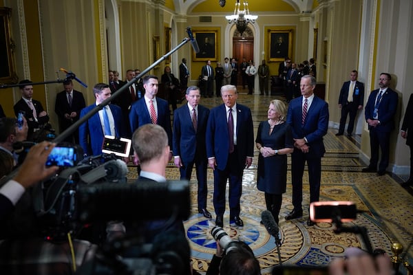 President-elect Donald Trump talks to reporters after a meeting with Republican leadership at the Capitol on Wednesday, Jan. 8, 2025, in Washington. From left, Vice President-elect Sen. JD Vance, R-Ohio, Sen. Tom Cotton, R-Ark., Sen. John Barrasso, R-Wyo., Trump, Sen. Shelley Moore Capito, R-W.Va., and Senate Majority Leader John Thune of S.D. (AP Photo/Steve Helber)