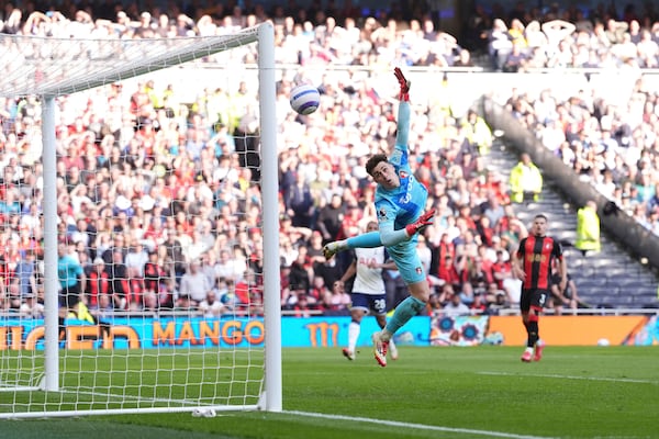 Tottenham Hotspur's Pape Matar Sarr scores past Bournemouth goalkeeper Kepa Arrizabalaga during the English Premier League soccer match between Tottenham Hotspur and Bournemouth, at the Tottenham Hotspur Stadium, in London, Sunday March 9, 2025. (Bradley Collyer/PA via AP)