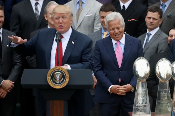 FILE - New England Patriots owner Robert Kraft, right, listen as President Donald Trump speaks during a ceremony on the South Lawn of the White House in Washington, April 19, 2017, where the president honored the Super Bowl Champion New England Patriots for their Super Bowl LI victory. (AP Photo/Andrew Harnik, File)