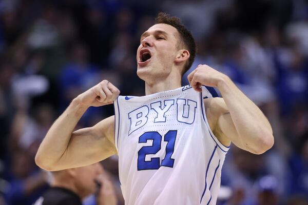 BYU guard Trevin Knell reacts to a play against Kansas during the second half of an NCAA college basketball game, Tuesday, Feb. 18, 2025, in Provo, Utah. (AP Photo/Rob Gray)