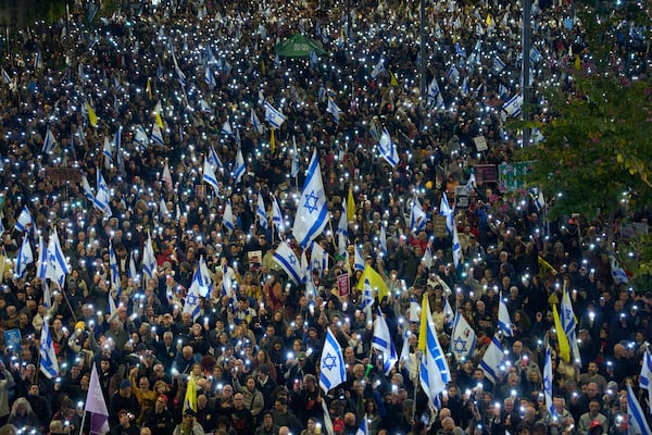 People take part in a protest demanding the immediate release of hostages held by Hamas in the Gaza Strip, in Tel Aviv, Israel, Saturday, March 22, 2025. (AP Photo/Ohad Zwigenberg)