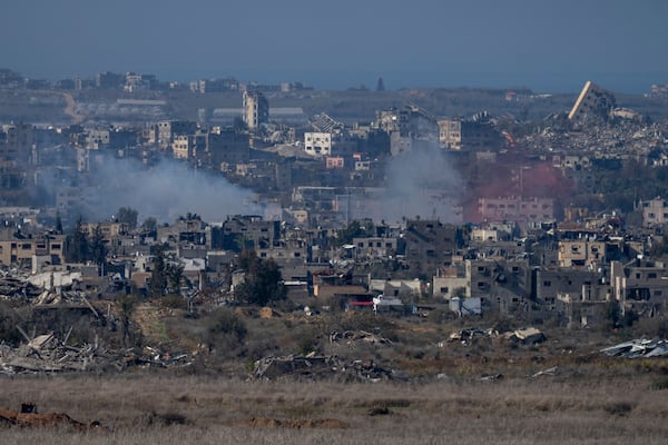 Smoke rises following an explosion in the Gaza Strip, as seen from southern Israel, Wednesday, Jan. 1, 2025. (AP Photo/Ohad Zwigenberg)