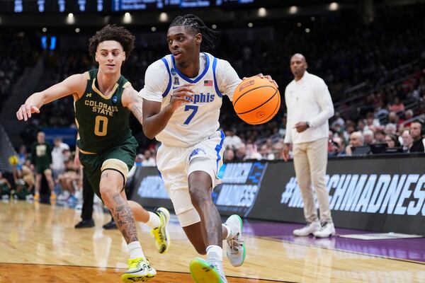 Memphis guard PJ Carter (7) drives to the basket against Colorado State guard Kyan Evans (0) during the second half in the first round of the NCAA college basketball tournament, Friday, March 21, 2025 in Seattle. (AP Photo/Lindsey Wasson)