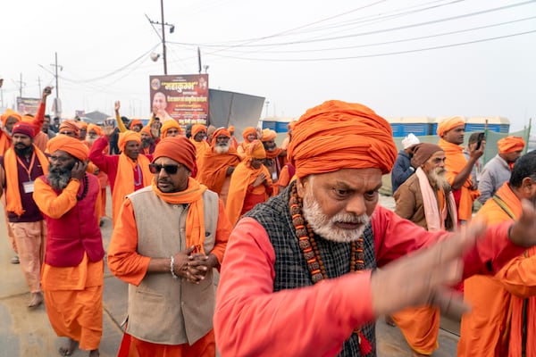 Hindu holy men walk in a procession a day before the 45-day-long Maha Kumbh festival, at the confluence of the Ganges, the Yamuna and the mythical Saraswati rivers, in Prayagraj, India, Sunday, Jan. 12, 2025. (AP Photo/Ashwini Bhatia)