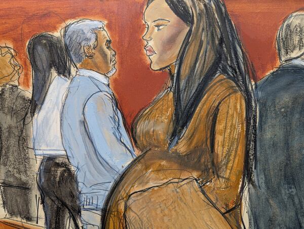 Cassie Ventura, right, walks out of the courtroom past Sean Diddy Combs after testifying in Manhattan federal court, Tuesday, May 13, 2025, in New York. (Elizabeth Williams via AP)