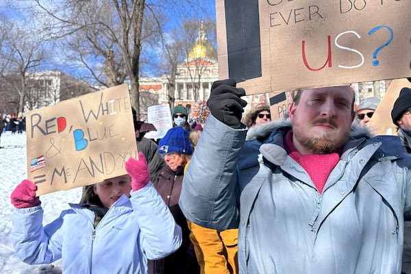 Demonstrators join more than a thousand people protesting the policies of the Trump administration marched from the Boston Common past City Hall to the North End, Monday, Feb. 17, 2025 in Boston. (AP/Michael Casey)