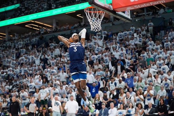 Minnesota Timberwolves forward Jaden McDaniels (3) goes up for a dunk during the second half of Game 2 of an NBA basketball second-round playoff series against the Golden State Warriors, Thursday, May 8, 2025, in Minneapolis. (AP Photo/Abbie Parr)
