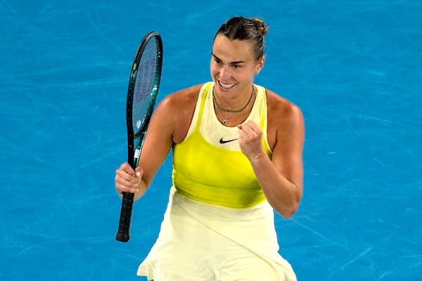 Aryna Sabalenka of Belarus celebrates after defeating Anastasia Pavlyuchenkova of Russia in their quarterfinal match at the Australian Open tennis championship in Melbourne, Australia, Tuesday, Jan. 21, 2025. (AP Photo/Vincent Thian)