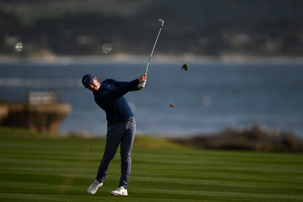 Rory McIlroy, of Northern Ireland, hits from the 18th fairway at Pebble Beach Golf Links during the final round of the AT&T Pebble Beach Pro-Am golf tournament, Sunday, Feb. 2, 2025, in Pebble Beach, Calif. (AP Photo/Nic Coury)