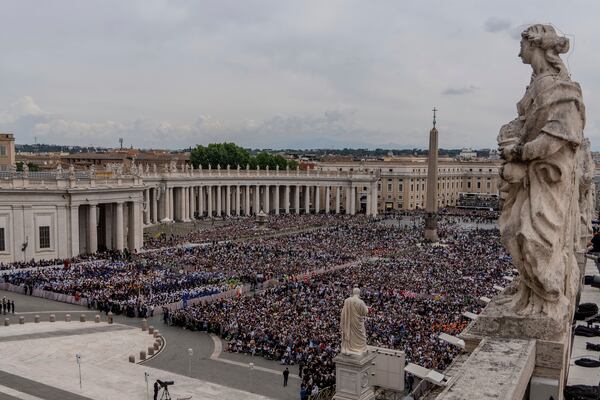 FILE - A crowd gathers in St. Peter's Square at the Vatican, where newly elected Pope Leo XIV will deliver a blessing from the central balcony of St. Peter's Basilica on Sunday, May 11, 2025. (AP Photo/Domenico Stinellis, File)