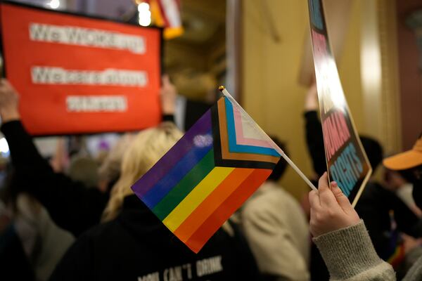 FILE - Protesters fill the Iowa state Capitol to denounce a bill that would strip the state civil rights code of protections based on gender identity, Thursday, Feb. 27, 2025, in Des Moines, Iowa. (AP Photo/Charlie Neibergall, File)